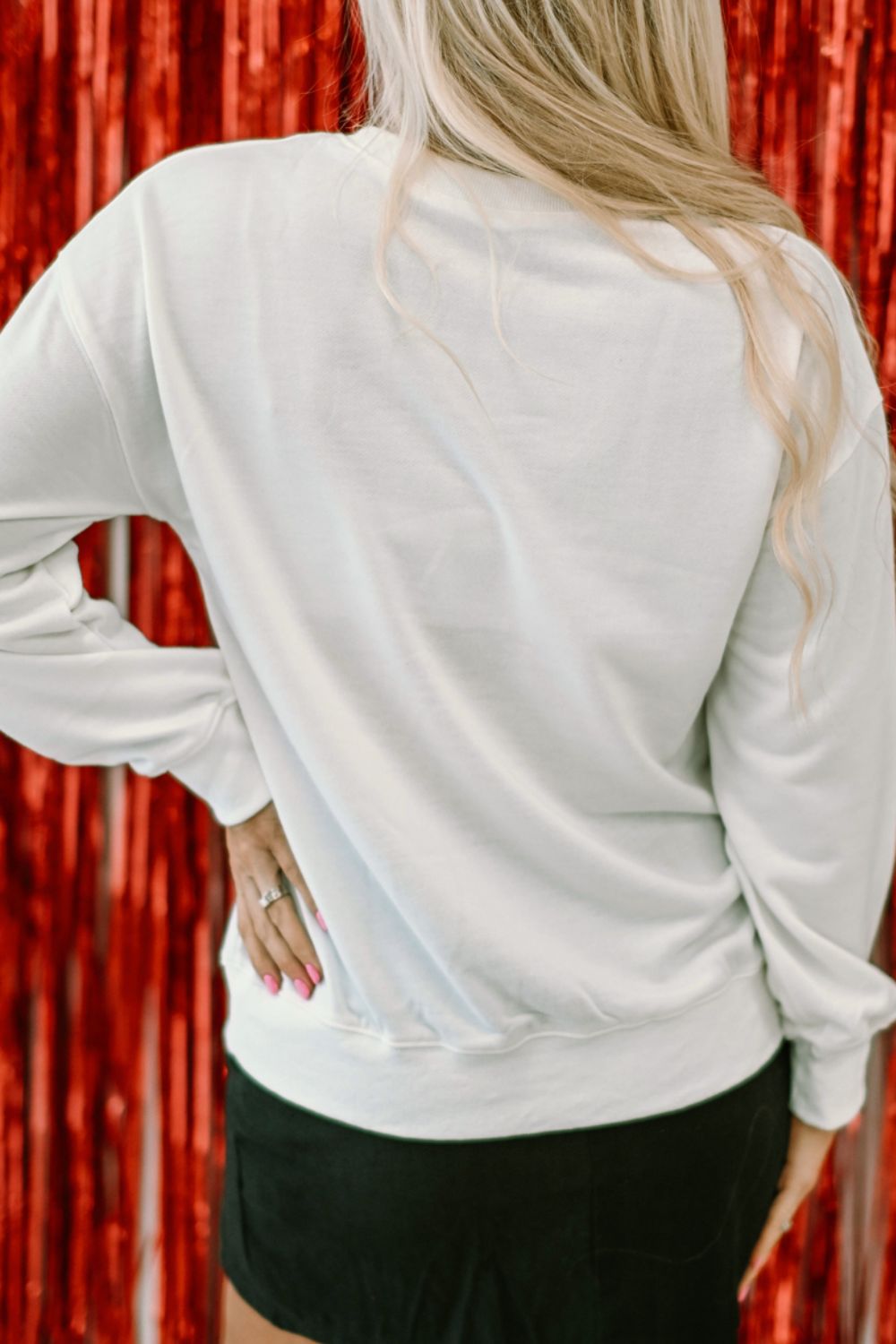 Valentine’s Day XOXO Glitter Round Neck Sweatshirt - White, 3/4 angled view on model - Be Juliet