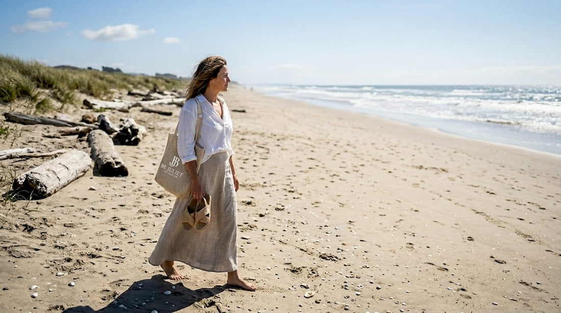 Woman in bohemian layers walking sandy beach