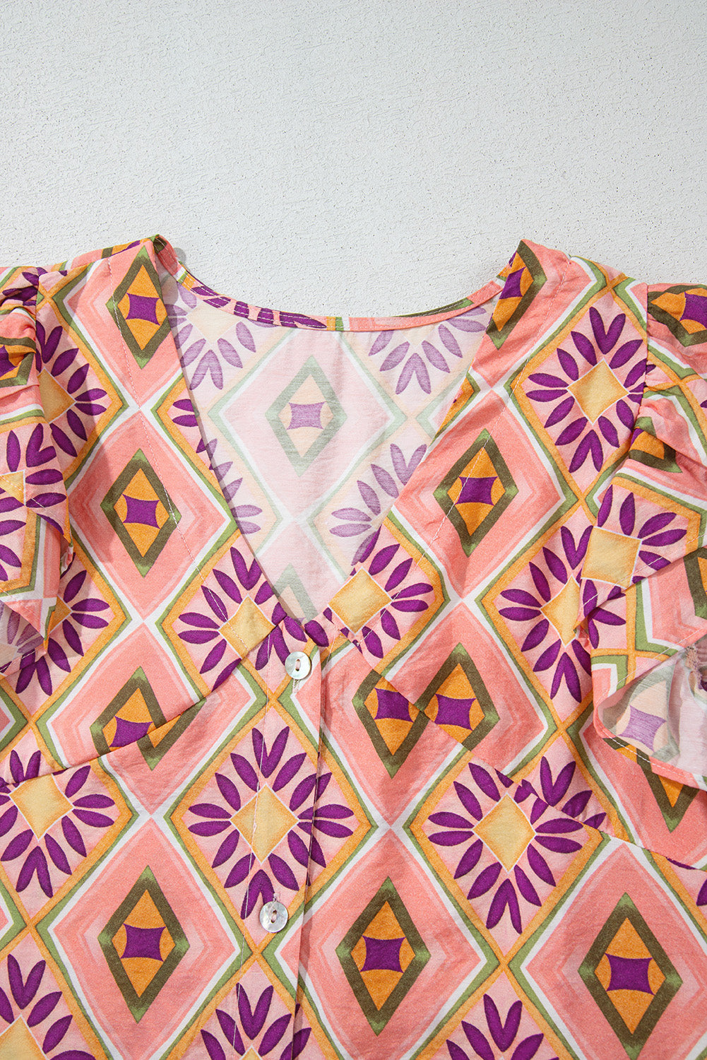 Geometric Floral V-Neck Button-Front Mini Dress - Orange, cropped waist-up view on model - Be Juliet