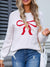 Angel Wings Bow Graphic Round Neck Long Sleeve Sweater - White, front view on model - Be Juliet