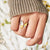 925 Sterling Silver Butterfly Ring - Gold, front view on finger - Be Juliet