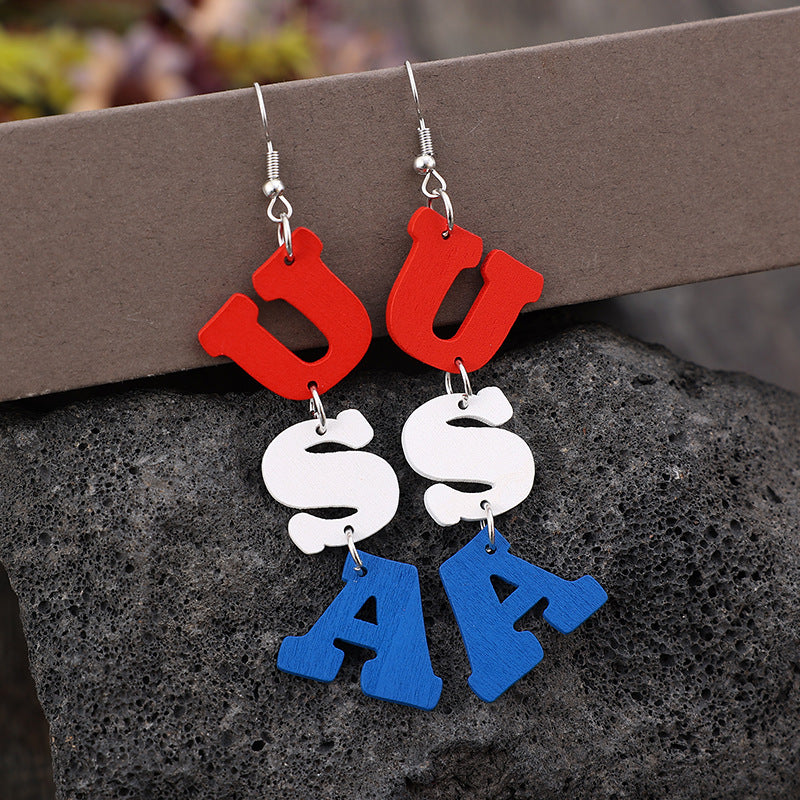 USA Wooden Letter Dangle Earrings - worn on model ear close-up - Be Juliet
