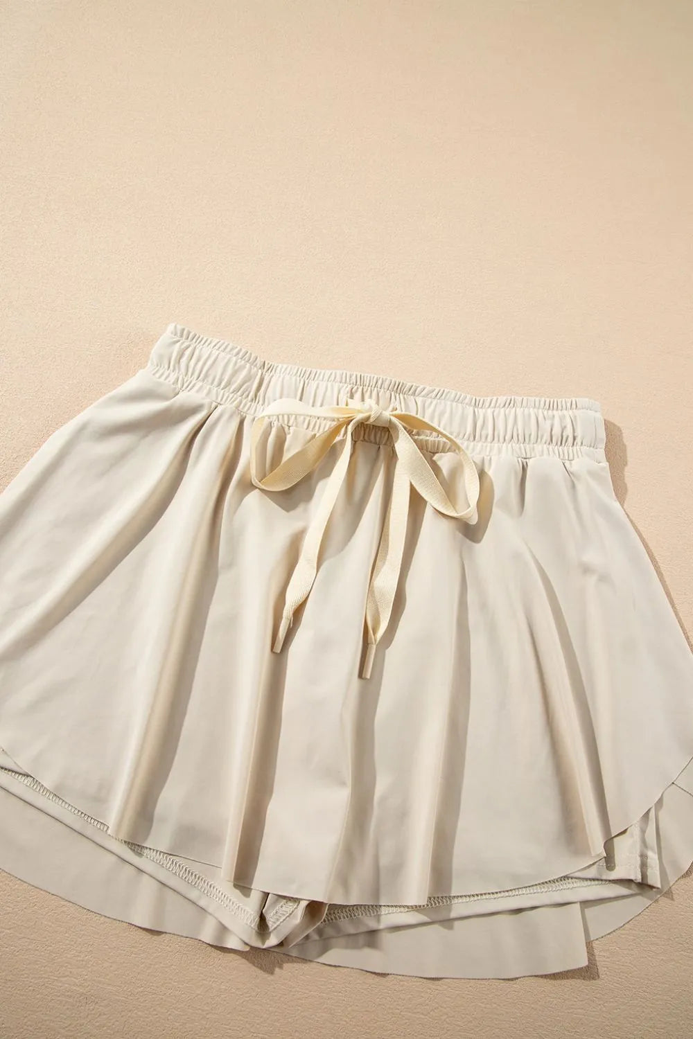 Romy Drawstring Active Skort - Light Blue, 3/4 angled view on model - Be Juliet