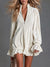 The Belinda Ruffle Mini Dress - White, front view holding bag - Be Juliet