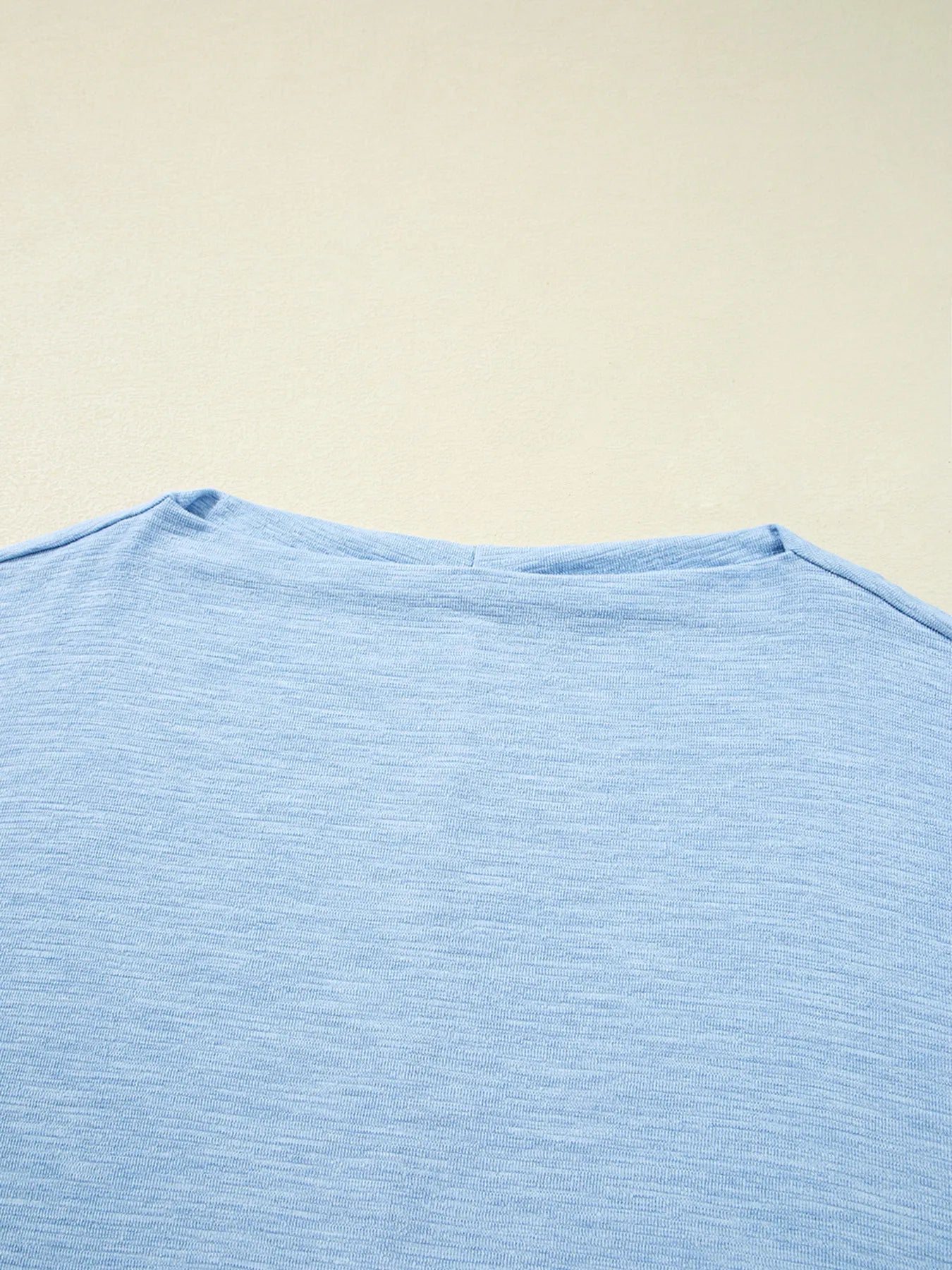 Maya Relaxed Batwing Top - Light Blue, 3/4 angled view on model - Be Juliet