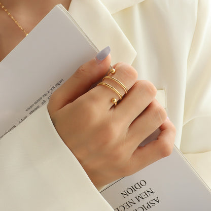 Titanium Steel Wrap Ring - Gold, side profile showing wrap design - Be Juliet