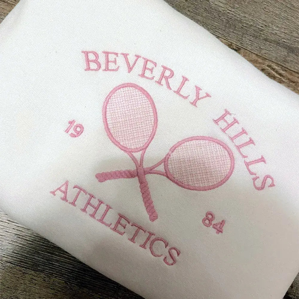 Serena Dreams Tennis-Inspired Sweatshirt - White, front view on model seated - Be Juliet