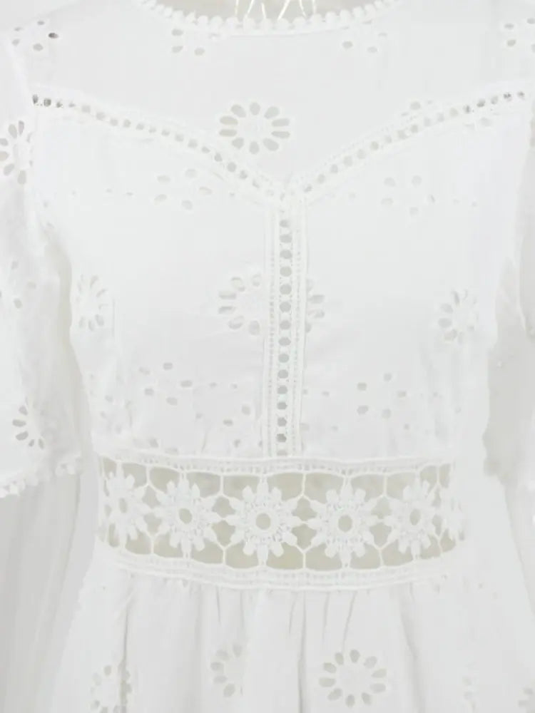 Isabella Summer Dress - WHITE, seated lifestyle pose on model - Be Juliet