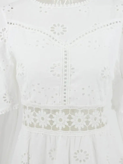 Isabella Summer Dress - WHITE, seated lifestyle pose on model - Be Juliet