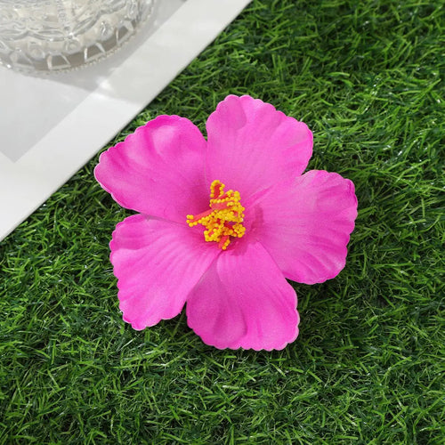 Away Hawaiian Flower Hair Clip - F, front view on model - Be Juliet