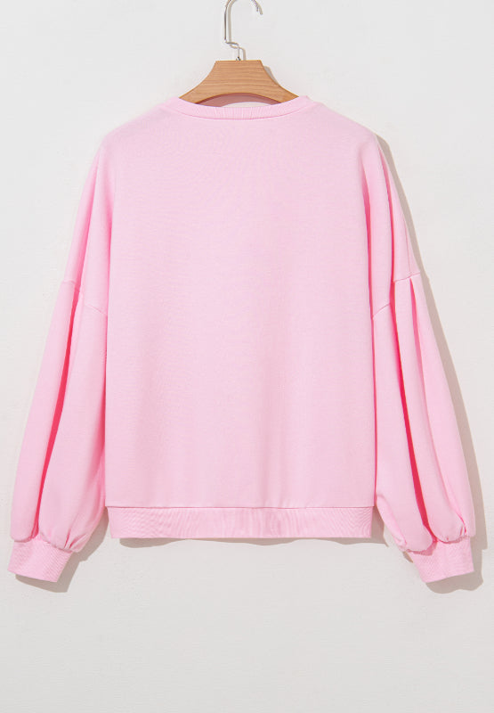 Bow Round Neck Long Sleeve Sweatshirt - Blush Pink, 3/4 angled view on model - Be Juliet