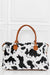 Leona Animal Print Brushed Weekender Bag - Black/White, front view on model - Be Juliet
