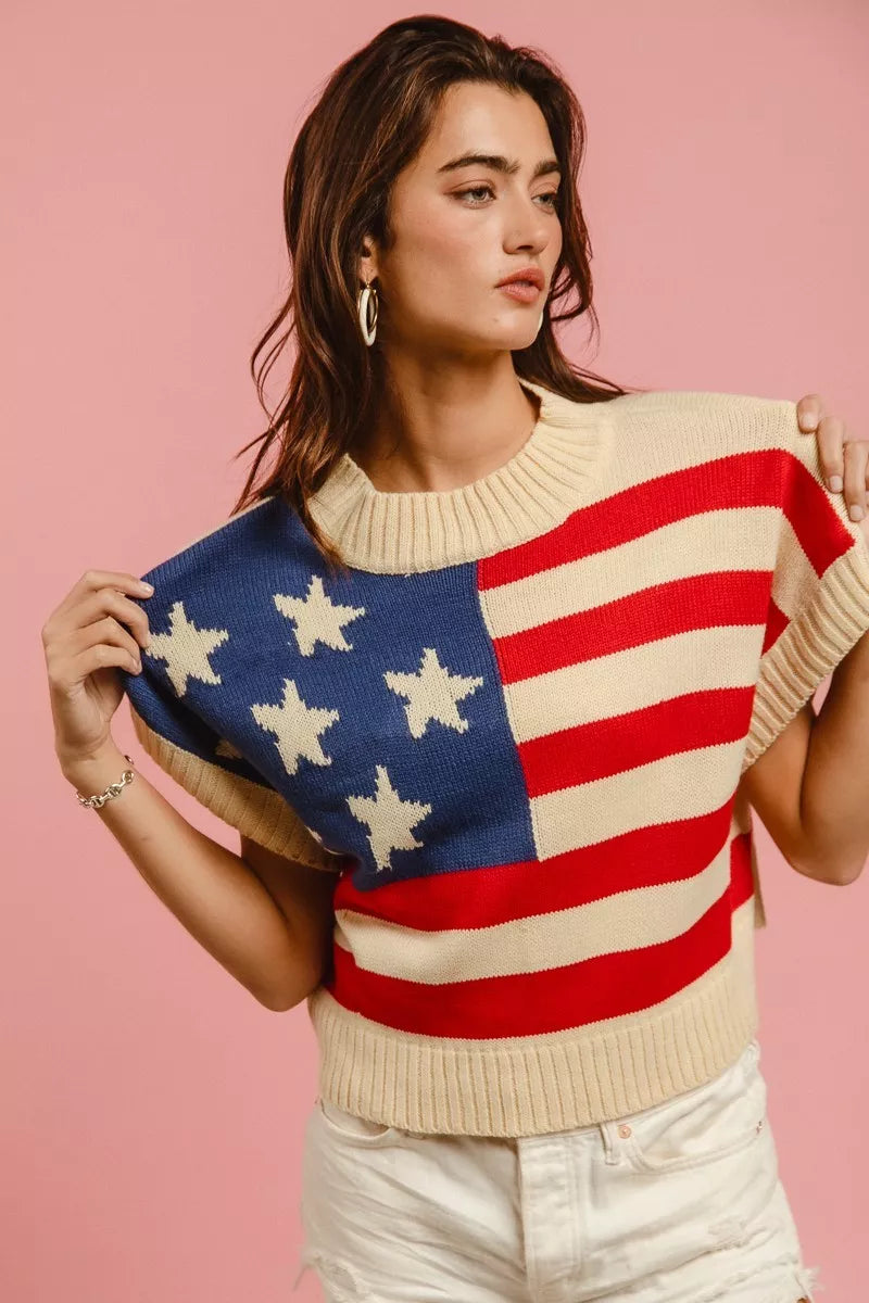 The Liberté — Star Patches American Flag Sleeveless Sweater - Vivid Red, front hem lift - Be Juliet