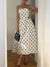 The Simone — Polka Dot Strapless Midi Dress - Cream, front view on model - Be Juliet