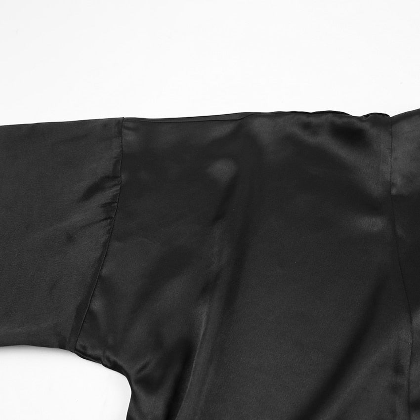 Ruby Feathered Robe - Black, seated view on model - Be Juliet